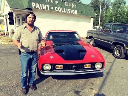 Classic Mustang outside New Hope Paint & Collision